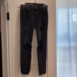 Black cropped skinny jeans with holes